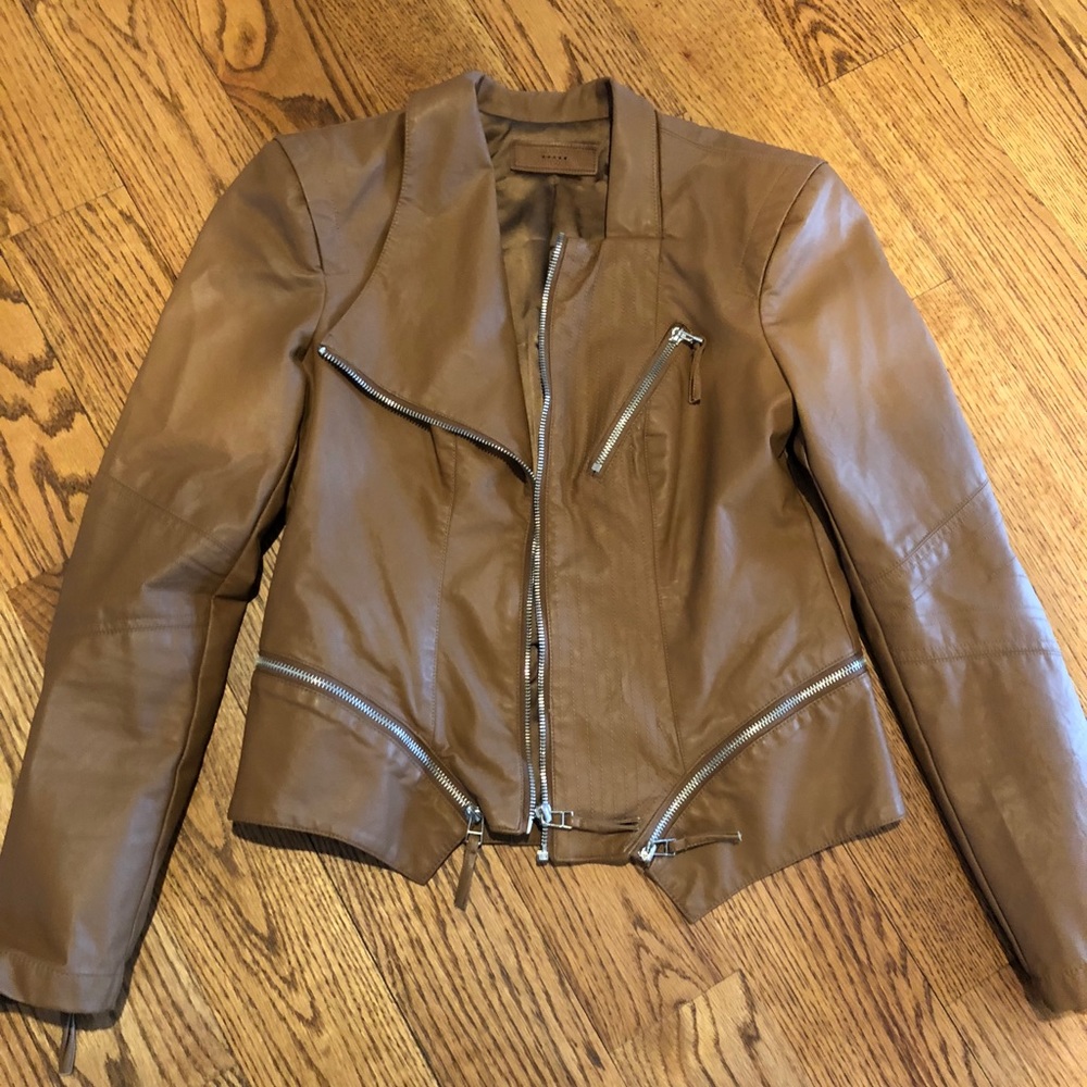 a brown leather vest